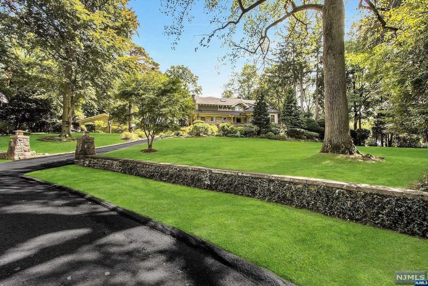 FABULOUS COLONIAL FEATURING 6 BEDROOMS, 6 FULL & 2 HALF BATHS LOCATED ON TENAFLY'S EAST HILL ON APPX. 1 ACRE OF RESORT STYLE PROPERTY WITH A FRESH WATER POOL. AMAZING FLOOR PLAN FOR EVERYDAY LIVING & ENTERTAINING! FEATURING AN OVERSIZED GREAT ROOM W/FP & A WALL OF FRENCH DOORS OVERLOOKING THE LUSH PRIVATE YARD, DINING RM W/BUILT-IN BAR, LR W/FP, SUN-DRENCHED GOURMET KITCHEN W/BRKFST AREA, MUD RM, OFFICE, PR AND GUEST SUITE COMPLETE THIS LEVEL. LARGE PRIMARY SUITE W/SPA-LIKE BATH W/RADIANT HEAT, 2 ENSUITE BEDROOMS, BEDROOM/OFFICE, FULL BATH, BONUS SITTING AREA, LAUNDRY RM & SECONDARY BACK STAIRCASE. LARGE LOWER LEVEL WITH SPACIOUS REC AREA W/CUSTOM BUILT-IN BAR, OVERSIZED GYM, ENSUITE BR, 1/2 BATH & ABUNDANCE OF STORAGE. FABULOUS OUTDOOR OASIS FOR ENTERTAINING, LARGE PATIO, GORGEOUS LANDSCAPING W/SPECIMEN TREES & EXPANSIVE LAWN. 3 CAR GARAGE, HOUSE GENERATOR, SECURITY/CAMERA SYSTEM, INDOOR/OUTDOOR SOUND SYSTEM. TOO MANY UPGRADES TO LIST. BLUE RIBBON SCHOOLS & MINUTES TO MANHATTAN!