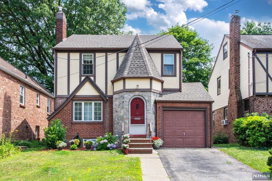 Your Home is Your Castle - Welcome to 41 Ferncliff Road in the Oak View section of Bloomfield. Located on a quiet tree lined street, this 3 bedroom Tudor Colonial with wonderful curb appeal offers large rooms , high ceilings, a wood burning fireplace in the living room, sparkling hardwood floors and a large eat-in kitchen. The comfortable 3 season rear porch overlooks a lovely large private back yard with patio. Generous sized bedrooms, large full bath and walk up attic.