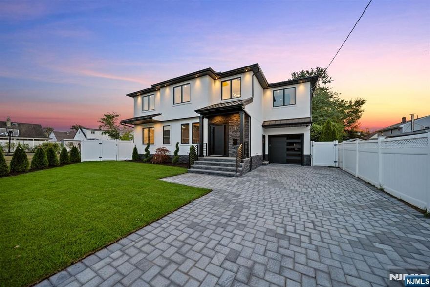 Experience refined living in this stunning new-construction 5-bedroom, 3-bath home, located on a cul-de-sac and thoughtfully crafted on an existing foundation with todayâ€™s modern lifestyle in mind. A paver driveway, and professional landscaping with fresh sod create exceptional curb appeal. The fenced backyard with 6â€™ vinyl fencing and multi-zone sprinkler system ensures both privacy and convenience. Step into a dramatic 2-story foyer leading to wide-plank white oak floors, modern staircase with rod iron balusters, bold accent wall, ceiling and mudroom leading to attached garage access. The inviting living room features a wood-burning fireplace framed by decorative exposed beams, while the chefâ€™s kitchen impresses with quartz counters and backsplash, an oversized island, and premium Samsung & Sharp appliances. The first floor offers a versatile bedroom, full bath, and open-concept flow designed for entertaining. Upstairs, find four spacious bedrooms and two baths, including a luxurious primary suite with a custom walk-in closet and spa-like bathroom with a custom double vanity. A second-floor laundry with washer/dryer hookups adds ease. The finished basement offers a large family room with tiled floors, a wine bar with sink, and plenty of space for gatherings. Additional comforts include 2-zone heating/cooling and central vacuum. Conveniently located and close to NYC transportation, this home blends elegance, comfort, and function in every detail, truly a must-see.