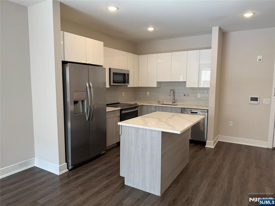 **ONE MONTH FREE on 13-month lease + one parking space included! - for occupancy commencing on or before 8/1/25!** Welcome to the Metro, Fort Lee's newest luxury building. All amenities INCLUDED in the rent, and REDUCED security to qualified applicants - The Metro features a variety of upscale, spacious floorplans. high-end residences fully equipped w/ modern kitchens w/ stainless steel appliances, quartz countertops, full islands & tiled backsplashes, open living/dining areas, shades on all windows, modern bathrooms & a full-sized washer & dryer in each unit. The Metro features a large elegant lobby, outdoor courtyard, outdoor terrace/garden, large club room and a on-site fitness center, which includes the Echelon Reflect mirror, electric car charging stations & INDOOR (covered) parking garage w/ direct elevator access to all residences for uncompromising security. Pet friendly (LB limit & fees apply)! Tenants pay utilities. PARKING: 1st assigned garage parking space - $150/mo (excluding promotion) ; 2nd assigned garage parking space - $100/mo. Virtual tour available upon request!