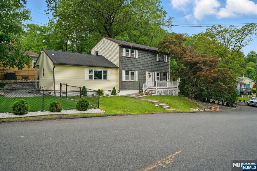 Charming Colonial just a short walk to Shore Hill Country Club & Lake Hopatcong. Move right in, just in time for summer. Shows pride of ownership. Lots of Generous Room Sizes to Spread Out & Make Your Own! Cozy living area with electric fireplace. Country Kitchen opens to dining area. Large family room with sliders to the patio and yard. 1st Floor Laundry & powder room. 2nd Level Offers 3 LARGE Bdrms & a Full Bath. Tons of Storage throughout, closets, attic, basement and garage!! Large paver patio- Perfect for Entertaining & Relaxation! Artificial grass makes this property LOW MAINTENANCE! Fenced in yard. Enjoy life on the NJ's Largest Lake - Boating, fishing, restaurants, ets! Easy access to highways.