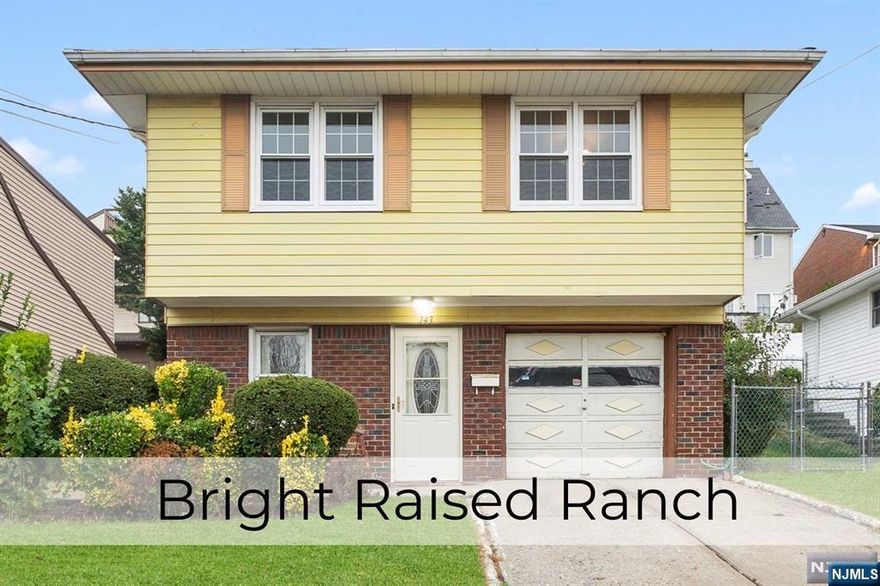 This bright 3-bedroom, 2-full-bath raised ranch home offers the perfect blend of comfort and potential. With its fresh coat of paint, this home is waiting for your personal touch. The versatile layout, featuring a ground-floor den, full bath, and laundry, provides endless possibilities for customization. The spacious first floor with hardwood floors is ideal for entertaining, with its large kitchen, and open dining room flowing into the living room. Enjoy the outdoors in the private backyard, perfect for relaxation or gatherings. Conveniently located near major highways, NYC bus stops, and Hackensack Hospital.