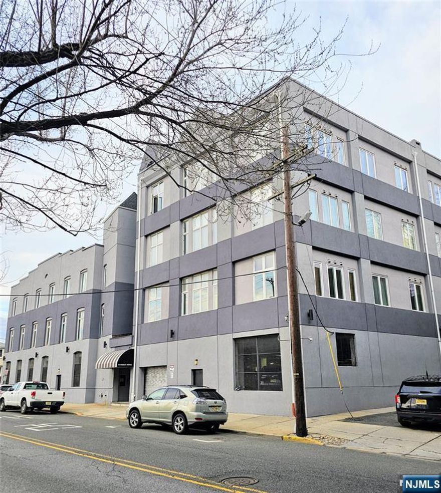 Great For Commuters, 20 Mins to Manhattan, Near Path Train Station, Walking distance to Rutgers University Composes. 2 Bedrooms Condo, Full Bath, Kitchen, Den and Livingroom combo, Washer/Dryer in unit, Central Air, Corner Unit with Lot of Windows and Brightness Included One car Indoor Garage Parking.