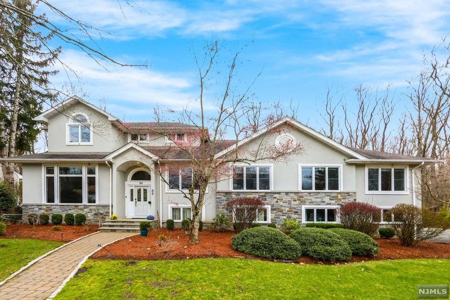 Planning your summer staycation??? This Modern and open concept home set back on an oversized lot backing up to Demarest woods with Gunite heated pool w hot tub is the perfect at home paradise! This beautiful home offers 5 bedrooms plus office and 4 full baths. living room with 13 ft. soaring ceiling, large gourmet new eat-in-kitchen with huge center island, high end stainless steel appliances, wine cooler, breakfast bar, dining rm with a fireplace and sliders to the paver patio. This home offers a spacious primary suite, bathroom and walk-in closet, 3 additional bedrooms and a family bath, an en-suite bedroom and a private office. Family room, Basement, Full house generator and more!