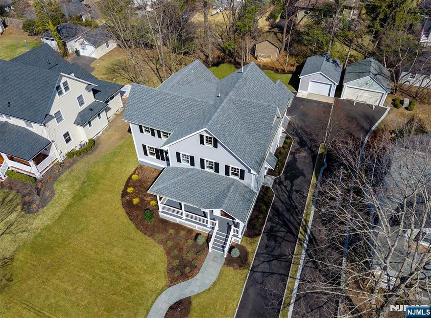 2025 FULL REMODEL & EXPANSION IN GREAT LOCATION. This newly renovated 5/6 bedroom, 6.5-bath colonial exemplifies elevated modern living, reimagined for sophistication and functionality. Interior highlights include an open concept, exceptional millwork, all 2nd-floor bedrooms ensuite, designer fixtures, a coffered ceiling dining room, all new systems, 2nd-floor laundry, and a large finished basement. At the heart of the home is a gourmet eat-in kitchen equipped with Wolf/Subzero appliances, quartz counters, and a wine fridge/bar, with seamless flow to a family room with a striking gas/marble fireplace and built-ins. Retreat to the vaulted primary suite with a beautifully designed spa bath and 2 walk-in closets. Sixth bedroom or home office, additional rec space, and a full bath on 3rd floor. Enjoy exceptional curb appeal in A+ location, with the convenience of walking to all 3 schools, Ridgewoodâ€™s bustling downtown, and transportation to NYC. A true luxury home!