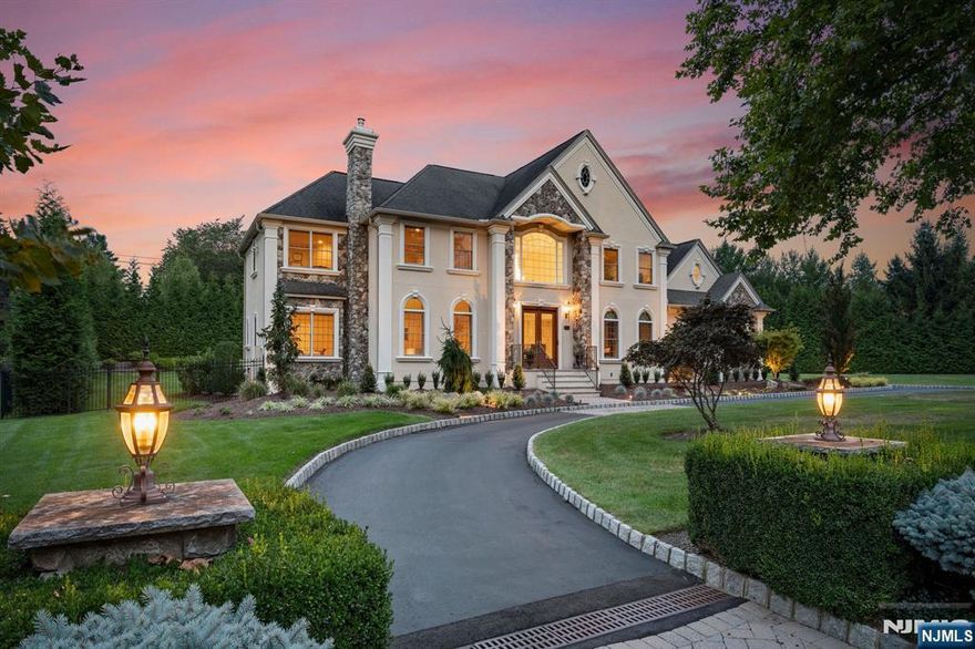 Nestled on a quiet cul-de-sac in prestigious Franklin Lakes, this 5-bedroom, 6.5-bathroom estate exudes luxury and sophistication. A grand two-story foyer with a sweeping staircase leads to a formal great room with a gas fireplace. The gourmet kitchen boasts a large island, high-end appliances, and a sunlit breakfast nook, while the formal dining room is perfect for elegant gatherings. A formal living room, first-floor en-suite, and office/den complete the main level. The primary suite is a true retreat with a sitting area, spa-like bath with soaking tub, and two custom walk-in closets. Each additional bedroom has an ensuite bath. The fully finished walkout lower level offers a home theater, entertainerâ€™s bar, rec area, gym, and full bath. Outside, the private backyard is ideal for entertaining. With a three-car garage,speakers thruout, radiant floors & many more upgrades, this home is immaculate & move-in ready â€”a rare Franklin Lakes gem!