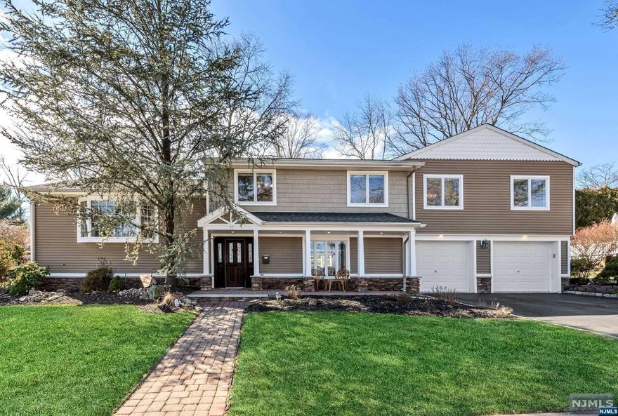 This expanded, custom home has been lovingly updated by current owners & is located in the sought after Valley section of Wayne. Entry foyer leads up to the open concept main living space drenched in light. Kitchen is beautifully updated & features a Viking Range, Bosch dishwasher, Franke sink, pot filler & quartz countertops. Island seating & wine refrigerator plus a French door to a walk-in pantry. Sliding door to spacious rear deck, patio & beautiful backyard. Dining room has gorgeous built-ins with backlit cabinetry, plus 2 glass front closets. Living Room is highlighted by the gas fireplace, recessed lighting & detail moldings. Spacious grade level family room is fabulous entertaining space w, large windows, & door to rear yard & 2 car garage plus powder room. Lower level basement/game room is great additional space. Primary suite has a private balcony, library room, spa bath, WIC. 2 additional bedrooms & hall bath, 3rd Bedroom with ensuite bath. Great rear yard with shed.