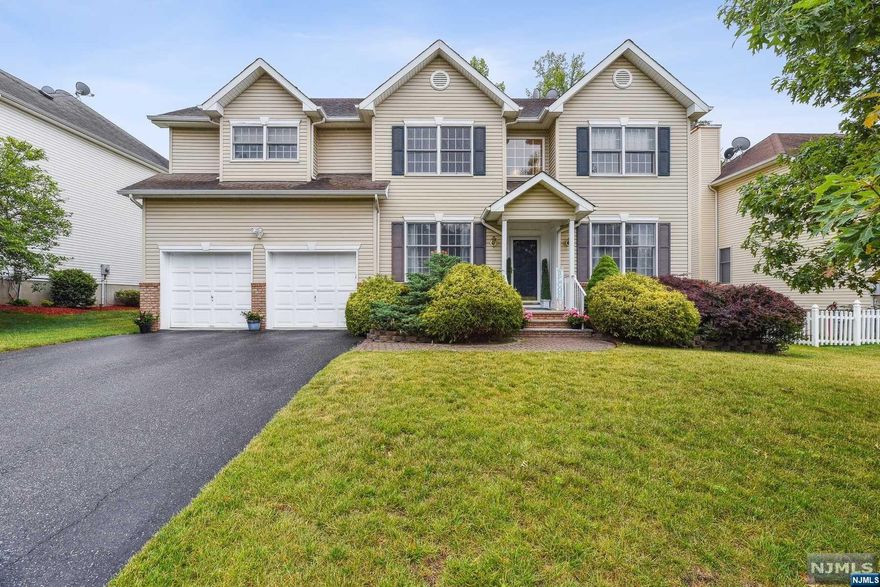 Timelessly elegant, located in highly desirable Paddock Farms in the Redwood section.4 Beds/3.1 baths Center Hall Colonial.Home features a spacious foyer, hardwood flrs on the 1st flr,hi-hats,crown moulding, paver patio,and finished basement. Eat-in-Kitch w/center island, Stainless appliances,walk-in pantry,and sliders to the backyard. Adjacent Family Rm is a welcome retreat with a wood burning fireplace. The formal living & dining rooms are poised for gracious entertaining. Upstairs provides 4 ample bedrooms.Primary suite provides 2 walk-in closets, spa like bath with jetted tub and oversized shower. On the lower level the full finished basement with full bath, Rec Room/Media Room, and laundry. Outside the paver patio and yard provides lots of space for entertaining, play and gardening. The newer covered bridge overlooks wooded nature preserve.Convenient to houses of worship, just steps away from schools,shopping,highways,NYC transport,and Jitney to the train station.