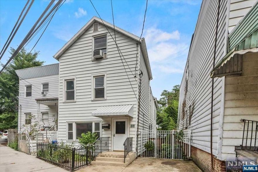 Welcome to this enchanting 3-bedroom plus den, 2-bath home complete with outdoor parking and backyard in the heart of Weehawken! As you enter, step into the spacious living room that seamlessly flows into a beautiful kitchen, complete with ample storage and a custom island. The first floor primary bed with walk in closet and en-suite bath also directly accesses the backyard. Upstairs, discover two additional bedrooms, a full bath, and large closets for all your storage needs. The highlight of this floor is the expansive den with soaring ceilings, strikingly unique and sure to WOW! The finished attic level offers a versatile space for a guest room or office. A full unfinished basement includes laundry and plenty of storage. This home will surprise and delight you in everyway!