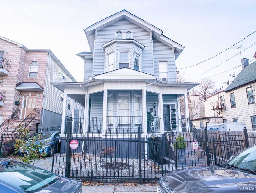 ONE OF A KIND!!! Two family, with TWO BONUS UNITS- collecting roughly $6,000+ a month. Fully renovated with 8 bedrooms, four FULL BATHS, forced hot air, newer siding, DRIVEWAY and so so so much more. Come turn this house into your home before someone else does.