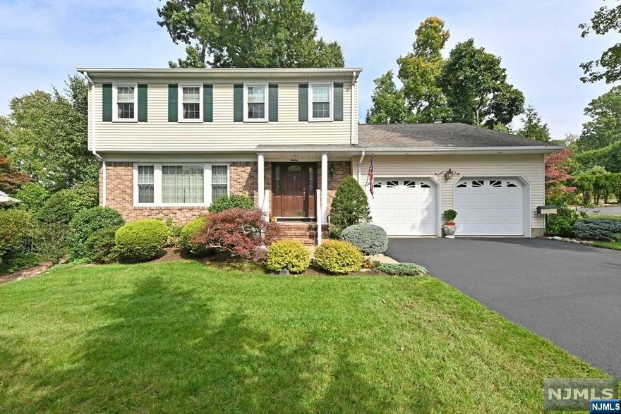 Large, well kept colonial in most desirable neighborhood of popular Emerson, NJ! 4 BRs & 2.5 bathrms including King Size primary BR w/en-suite bathrm! Deceptively large 1st flr, great for entertaining, w/formal living rm, large formal dining rm, large eat-in kitchen & a fabulous family rm w/attractive exposed beams, skylights & a beautiful brick surround fireplace w/new gas ceramic log insert! Perfect for relaxing during the upcoming Holiday Season! Also a huge finished bsmt w/wet bar for Rec Rm, Play Rm, Gym & More! Pool table included! Bonus office in bsmt too! Other features include central AC, hardwood flrs, 200 amp upgraded electric, new hot water htr, inground lawn sprinklers, backup generator, 2 car garage, & large double wide driveway! Offers so much, plus potential for you to customize to your own designs. All this on a prime street w/great curb appeal to make you happy to drive home each night! Dont miss this one!