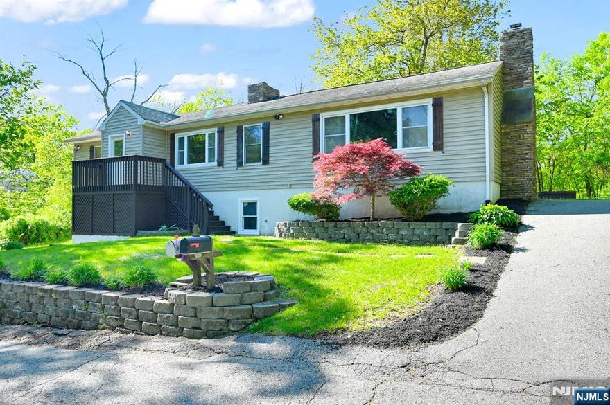 Raised Ranch Home, Updated in 2024, 2 Fireplaces, Huge Vaulted Living Room w/ Stone Fireplace, Skylights & Beam Ceiling. Finished Basement, 1 Car Garage, Corian Kitchen, Central Air & More 2 Bedroom Septic Per Township. Central Air, Heated Garage, Newer Septic & Well Pump, Large Level Back Yard with a Hot Tub ! Spacious Laundry Room. Additional Attic & Ground level complete with a Game Room and Wet Bar and additional Storage. Lake Rights to Motor Boat Lake: Upper Greenwood Lake. Beach, Clubhouse, Swimming, Lifeguards, Fishing, Water & Jet Skiing.