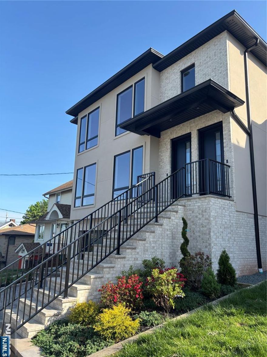 AMAZING RENTAL PROPERTY! NEW CONSTRUCTION. 1st fl unit offers 3 bedrooms, 2 full baths with that modern look. All stainless steel appliances. All hardwood floors. Deck. Laundry in unit. Heat and electric included. Gas fireplace. Tenant has use of yard.