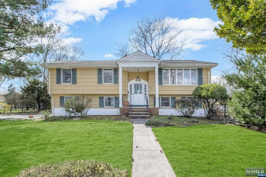 Beautifully Expanded 4-BR Home with an Open Floor Plan in Paramus! Large and bright living room, open to the dining room and well-maintained eat-in kitchen including granite countertops, a center island and wood cabinets. Expansive family room off of the kitchen featuring wall-to-wall windows for natural light, and access to the deck. The large primary suite includes an updated full bath and dual closets. Two spacious bedrooms and a full bath completes this level. The walk-out lower level offers a large den with access to the backyard. A spacious bedroom, laundry room/half bath and the 2-car garage completes this level. The large, lush property includes a fenced in backyard with a patio. Great for entertaining! Great opportunity to live in one of the most sought after areas of Paramus!!