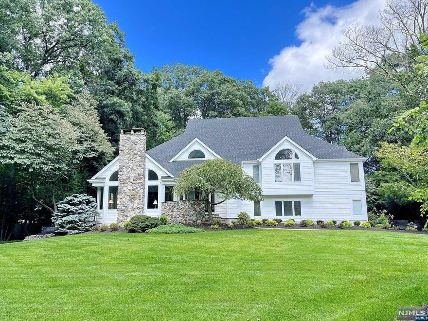 COME AND VIEW THIS SPACIOUS 5 BEDROOM, 3.5 BATH, CUSTOM DESIGNED COLONIAL STYLE HOME. SITUATED ON A PRIVATE .86 ACRE PROPERTY SET ATOP OF THE CREST OF DOGWOOD HILL RD, OFFERED IN THE PRESTIGIOUS UPPER SADDLE RIVER'S EAST HILL SECTION OF TOWN ON THE SADDLE RIVER BOARDER. APPROX 5500 SQFT OF QUALITY THROUGH OUT. ENTER THE FIRST FLOOR INTO THE 2 STORY FOYER, POWDER RM, LIVING RM/GAS FPL/DRS TO DK, TRAY CEILING BANQUET SIZE FORMAL DINING RM, VAULTED CEILING GREAT RM/FPL, MODERN EAT IN KITCHEN WITH BREAKFAST AREA. 2ND.FLOOR OFFERS A LG.HIGH CEILING PRIMARY BR WITH FBTH/TUB&SS, 3 MORE LARGE BEDROOMS AND A HALLWAY FBTH/SOT. 3RD.FLOOR HAS A OPEN LOFT WITH MANY OPTIONS AND USES. THE GROUND FLOOR HAS A PRIVATE ENTRY, 3 CAR ATTACHED GARAGE, GUEST BEDROOM FBTH/SS & LAUNDRY RM. FINISHED BASEMENT WITH RECREATION RM, GYM, UTILITIES AND PLENTY OF STORAGE SPACE. IN CLOSE PROXIMITY TO AWARD WINNING SCHOOLS, SHOPPING AND HWYS!!