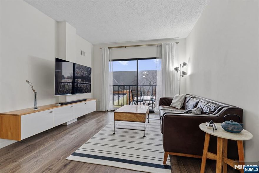 Beautifully fully renovated 2-bedroom, 1-bath condo featuring modern finishes throughout. Enjoy brand-new flooring, a stunning updated kitchen with quartz countertops, new appliances and a fully renovated bathroom.This bright unit also offers a private balcony, in-unit washer, plus access to a convenient building laundry room. Includes one deeded garage parking space. Centrally located, close to major roads and NYC transportation. Move-in ready and perfect for comfortable, low-maintenance living!