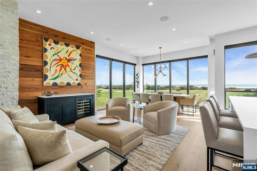 Fabulous four-level townhome with direct ocean view & over 3,100 sq. ft. of expansive living space. Featuring five bedrooms & five full bathrooms, this residence offers the convenience of a private elevator which opens on every floor. Interior highlights include an elegant open-glass staircase accented with Arctic White stone, a custom walnut TV feature wall & a chef's kitchen with Sub-Zero & Wolf appliances, Caesarstone Carina quartz countertops & Ultra Craft Arctic White cabinetry. The crown jewel is the spectacular private rooftop deck, complete with a Lynx gas grill & fire pit, where you can take in sweeping views of the Atlantic Ocean!