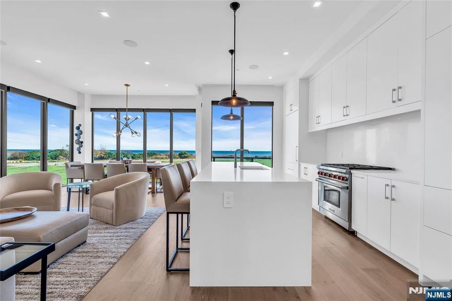 Fabulous four-level townhome with direct ocean view & over 3,100 sq. ft. of expansive living space. Featuring five bedrooms & five full bathrooms, this residence offers the convenience of a private elevator which opens on every floor. Interior highlights include an elegant open-glass staircase accented with Arctic White stone, a custom walnut TV feature wall & a chef's kitchen with Sub-Zero & Wolf appliances, Caesarstone Carina quartz countertops & Ultra Craft Arctic White cabinetry. The crown jewel is the spectacular private rooftop deck, complete with a Lynx gas grill & fire pit, where you can take in sweeping views of the Atlantic Ocean!