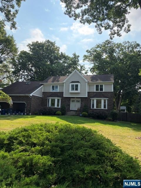 Photo of 409 Woodland St, Englewood, NJ 07631 (MLS # 26027256)