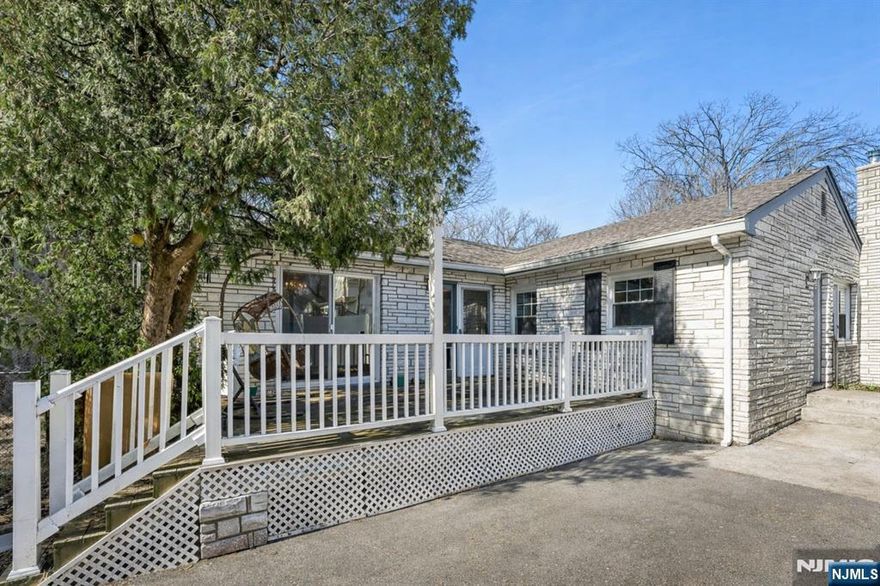 Opportunity in desirable Rutherford! This 3-bedroom, 2-bath ranch offers excellent potential for buyers looking to renovate or customize a home to their taste. The home sits set back from the street, offering added privacy, and features a long driveway providing ample off-street parking. Inside, the property offers a functional single-level layout with a partially finished basement that provides additional flexible space and storage. The yard configuration is unique, with the primary outdoor space located in the front of the home rather than a traditional backyard. Ideally situated approximately 1 mile from the Rutherford train station and close to major highways, making commuting convenient. With the right vision and updates, this property presents a strong opportunity to create value in a sought-after Bergen County location.