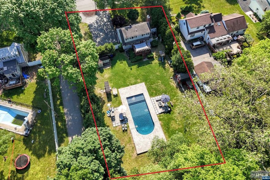 Charming Expanded Cape Cod on Oversized Lot with Luxurious Outdoor Amenities Welcome to this beautifully expanded Cape Cod home, nestled on a generously sized lot that promises both privacy and space. This property boasts an inviting inground pool and a spacious patio area, perfect for outdoor entertaining and relaxation. Step inside to discover a thoughtfully designed interior featuring an open floor plan that seamlessly connects the living spaces. The updated kitchen, equipped with modern appliances and stylish finishes, serves as the heart of the home and is ideal for both everyday living and hosting gatherings. With four well-appointed bedrooms and two fully updated baths, this home provides ample space for family and guests. Each bedroom offers comfort and tranquility, while the updated bathrooms showcase contemporary fixtures and finishes. Experience the perfect blend of classic charm and modern convenience in this expanded Cape Cod. Lender may require flood insurance!!!