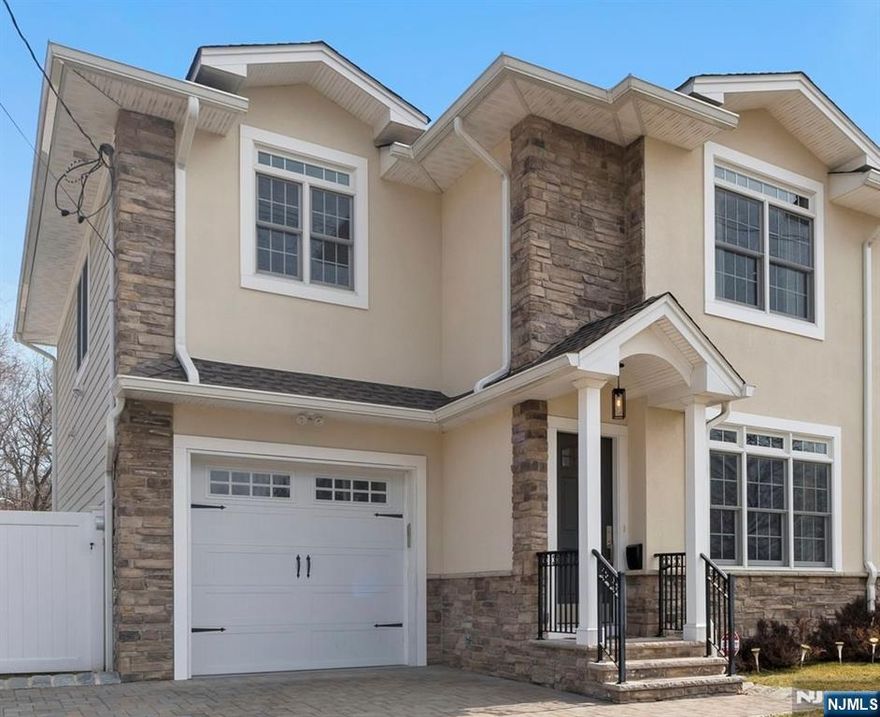 Step into this stunning 4 bedroom, 3.5-bath half-duplex. Built in 2020, this newly constructed 2,520 sq. ft. luxury home offers an open-concept kitchen and dining room, featuring quartz countertops, stainless steel appliances, under-cabinet lighting, and a butlers pantry. Enjoy the spacious living room with hardwood floors, and large Andersen 400 windows. The primary suite boasts a walk-in closet, & en-suite bath w/ double vanity, jetted tub, and stand-up shower. The finished basement includes a family room, full bath, and waterproof vinyl flooring. Outdoor highlights include a 6-car paver driveway, attached garage with epoxy flooring, and a private fenced-in backyard with a paver patio. Additional features include recessed lighting, energy-efficient multi zone heating/cooling, tankless water heater with an 80-gallon heated storage tank, and 200-amp electrical service. Don't miss your chance to call move-in-ready home your own!