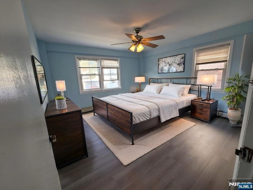 Bright 2nd-floor apartment in owner-occupied two-family home. 2 large bedrooms (fit king and queen beds) with ceiling fans, 1 bath, living room, eat-in kitchen, deep closets, and plenty of natural light. Hot water included; tenant pays gas/electric. No pets. Quiet street with ample parking. Bus #40 one block away, 13 min drive to Harrison PATH Station. Close to shopping, houses of worship, and NYC. Application requires ID, credit check, proof of income, and interview. 1.5 months security deposit required.