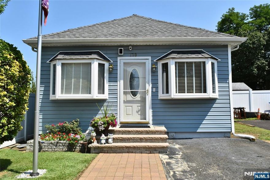 Move in and enjoy Shore Community Living within minutes to Ideal Beach and Monmouth Cove Marina. Beautifully maintained and updated Ranch featuring Living Room, Dining Area, Modern Kitchen, Full Bath and three bedrooms. As you enter the home, you are greeted with hardwood floors and neutral decor. Looking for low maintenance property, this home is for you with the yard mostly in pavers to enjoy a nice gazebo with sitting furniture, patio table, storage shed and deck off the back kitchen door. In 2014 - windows, roof & siding were replaced. 2024 new Furnace installed. Kitchen and bathroom are updated. Pull down attic access in Dining area. Due to new flood maps, home is listed in flood zone and owner states that they never had water including during Sandy. Flood insurance approximately $1,500.