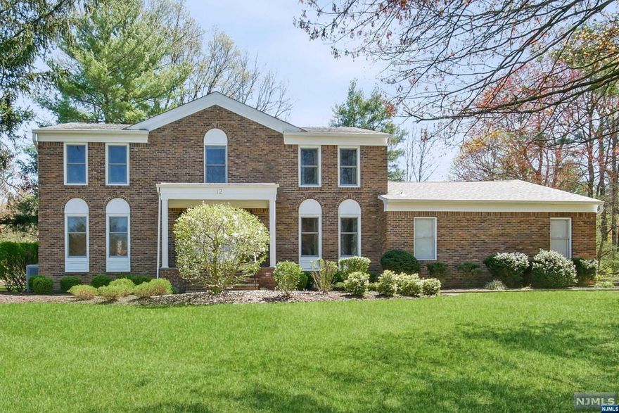 Bright and airy, this custom Center Hall colonial located in Livingston's Prestigious Chestnut Hill section, boasts 5 bedrooms. 4.5 baths, including a 1st floor guest suite with en-suite bath, and many recent updates. Enjoy a sun drenched interior with a custom center island kitchen, luxurious primary bath featuring a jetted tub and stall shower . situated on nearly an acre of lush, landscaped grounds. Abundant closet space, a full finished basement with rec-room, exercise area, office, bath and wine cellar, plus all new mechanical systems and roof replaced in the past 3 years, complete this very inviting home. Located in Livingstons Blue Ribbon School District, close to NYC Transportation, recreation, shopping and dining
