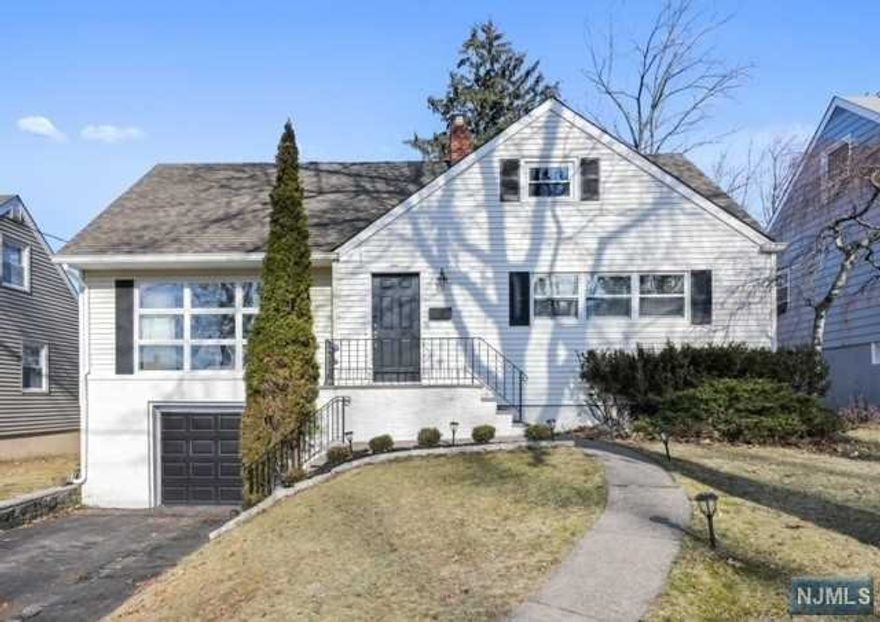 Recently updated four-bedroom, two-bath Cape located in a quiet neighborhood with easy access to major highways. Set on a hill, you can watch the sunset from the living room windows. Top-rated Redwood School just blocks away. A private backyard and two-level deck make outdoor entertaining easy. Gleaming hardwood floors, loads of spacious closets, and storage space. Natural light fills the home and the first-floor primary bedroom plus renovated full bath are welcome extras. The living room opens to the dining room, and the kitchen, with stainless steel appliances, has access to the back deck. The second level has two bedrooms and a full bath. Bright basement with laundry room and plenty of space to create a recreation or media room. The attached garage is entered through the basement. Dual central air system and recently installed SimpliSafe security system.