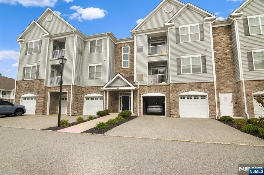 Welcome to Lakeland Village! This spacious 2-bedroom, 2-bath condo offers over 1,300 sq. ft. of contemporary comfort within a beautifully maintained community built in 2016. The open-concept design with high ceilings creates a bright, airy atmosphere, seamlessly connecting the living, dining, and kitchen areasâ€”perfect for both everyday living and entertaining. The modern kitchen features granite countertops, stainless steel appliances, and abundant cabinetry. Additional highlights include an in-unit washer and dryer, central air, a private outdoor space, a roomy garage with driveway parking, and a separate storage closet. Ideally located near shopping centers, dining, parks, and major highways, Lakeland Village offers the perfect balance of convenience and tranquility. Move-in ready and immaculate, this home is ready to welcome youâ€”just unpack and enjoy.