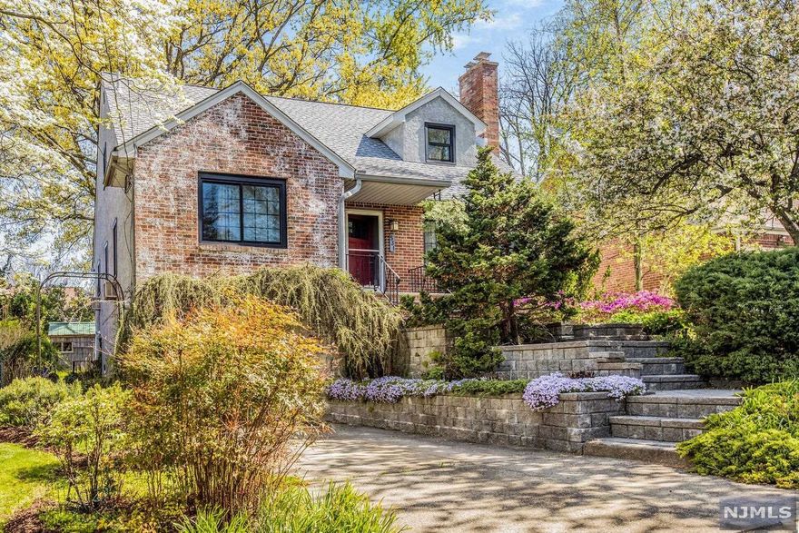 Welcome to this brick cape cod with beautiful landscaping all around. This move-in ready home has an inviting outdoor porch entrance that leads to the interior open floor plan w/ hardwood floors all throughout. The living room has a wood-burning fireplace, the kitchen has a skylight, formal dining room w/ french doors that leads to a nice sized trex composite deck & private backyard w/ a fish pond with a waterfall - the perfect retreat for relaxing. The first floor features two bedrooms & brand-new full bathroom with a bath & stall shower. The second floor has 2 additional bedrooms With plenty Of closets/storage & full bathroom. The finished walkout basement has a summer kitchen & half bath + lots of space for entertainment & gatherings. Centrally located to transit, shops, schools & parks + close to route 4 & just a few minutes from the George Washington bridge. Won't last so come see it today!