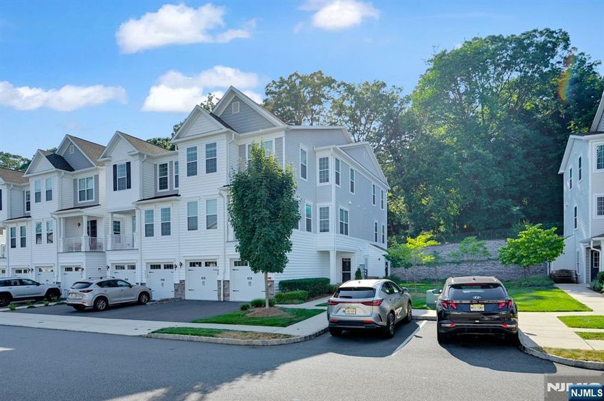 Prepare to be captivated by this designerâ€™s dreamâ€”an END-unit 2-bedroom, 3-bath condo brimming with upgrades and style at every turn. A welcoming foyer opens to a stunning eat-in kitchen with a quartzite waterfall-edge island seating four, GE Profile stainless steel appliances, custom hardware and lighting, plus a pantry with bar area. The first-floor full bath dazzles with designer touches, while the spacious living room with gas fireplace flows to an extended private patio and open side yardâ€”no homes behind for added privacy! A gracious dining area completes the light-filled main level. Upstairs, the primary suite is a retreat with a spa-like en suite featuring double sinks, a walk-in closet, and serene rear views. Laundry is conveniently on the same level. Additional highlights include a meticulous 1-car garage with abundant storage and overhead shelving. The vibrant community offers a clubhouse with kitchen and party space, infinity pool, barbecue/picnic areas, and direct access to miles of trails in Hilltop Reservation. All this just minutes to Montclair, with a free Hilltop commuter shuttle, Cedar Grove Park across the street, and the community center next door.