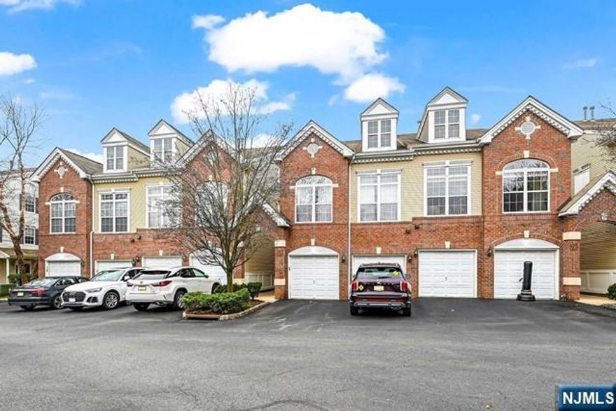 Discover the charm of this 2-story Albright model townhome in The River Walk II! With an inviting open layout, enjoy the upgraded cherry cabinets, granite countertops, stainless appliances, and a convenient breakfast bar in the kitchen, complemented by sliding glass doors leading to a delightful patio. The main floor features gleaming hardwood floors, a powder room, mud room, and a washer & dryer for added convenience. Upstairs, unwind in the spacious primary suite complete with a spa-like bathroom, expansive custom closet, and a private balcony. Accompanied by a generously sized second bedroom and another full bath, there's ample space for comfort. Storage won't be an issue with large closets throughout, supplemented by a 1-car garage and driveway parking. Freshly painted, this home radiates a welcoming ambiance. The Riverwalk community offers a host of amenities including a pool, tennis courts, and clubhouse, while its prime location provides easy access to shops, restaurants, bus stops, and the train station, making commuting a breeze with NYC just 9 miles away.