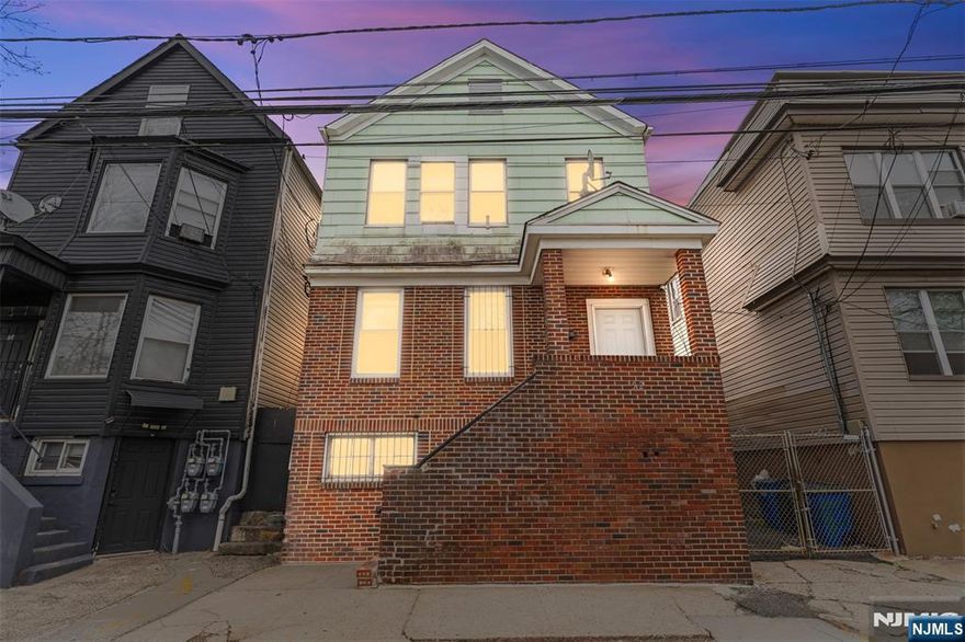 Welcome to 92 S Devine St, an exceptional two-unit property in Newark's Lower Vailsburg neighborhood boasting direct views of Vailsburg Park right across the street. Ideal for investors or owner-occupants, the second floor will be delivered vacant with the 1st floor potentially being vacant as well. Each unit offers 3 bedrooms, 1 bathroom, bright interiors, wood-look flooring, and modern kitchens with stainless steel appliances. The unfinished basement features a separate entrance, offering a great blank canvas for future renovation. Outside, enjoy a private backyard and a driveway fitting at least 3 cars. The location is an absolute commuter's dream: it is just 1 block from the NYC express bus (30 minutes to Port Authority) and a 1-minute drive to the Garden State Parkway. You are also only 15 minutes from Newark Penn Station, Newark Airport, The Mills at Jersey Gardens, and Weequahic Golf Course. Schedule a private tour today!