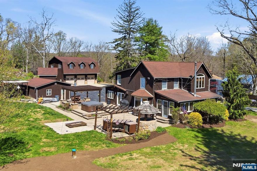 One-Of-A-Kind Craftsmanship With Everyday Function In This Thoughtfully Designed Property. The Custom Eat-In Kitchen Features A Breakfast Bar, Beamed Ceilings, Remote Skylights, Granite Countertops, Radiant Heat Beneath Penn Dutch Hardwood Floors, Commercial-Grade Dacor And KitchenAid Appliances, Bronze Cast Farmhouse Sink, Prep Sink, Electric Fireplace, And Built-In Desk. The Home Offers All-New Lighting, Beautifully Renovated 2025 Bathrooms, A New 500+ Ft Drilled Well With The Original Well That Can Be Used For Irrigation, New Water Softener And Well Tank, On-Demand 240 Gallon Hot Water Tank, Central Vac, Surround Sound, And Pocket Doors Leading To A Sunroom With Wood-Burning Stove And Walkout To The Patio With Outdoor Fireplace And Fire Pit. The Second Floor Includes 3 Bedrooms And 2 Full Baths, Including A Primary Suite With Private Full Bath And Walk-In Closet. Exterior Highlights Include A Large Paver Patio, Kohler Whole-House Generator, Detached 24'x22' Ice House With Upper/Lower Storage And 50-Amp Service, Plus A 35'x42' (1,470 Sq Ft) Oversized 3-Bay Garage With 200-Amp Panel, And Car Lift Ready. Additional Features Include 50-Amp RV Service And 2-Car Garage With 50-Amp Electric. Ideal For Car Enthusiasts, Hobbies, Or Entertaining Year-Round. Close To Route 23 And Just 1 Hour To NYC! So Much To See And Opportunities Like This Are Few And Far Between!