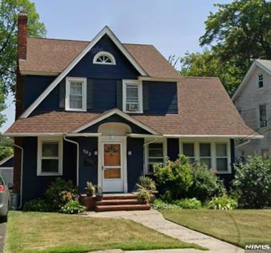 Welcome to this beautifully maintained Center Hall Colonial blending timeless charm with modern updates and flexible living space. The sun-filled eat-in kitchen features stainless steel appliances including a Bosch dishwasher, 36" LG double smart oven, and Samsung smart refrigerator. A formal dining room is perfect for entertaining, while the living room offers a cozy wood-burning fireplace. A spacious main-floor office, ideal as a sunroom or den, adds valuable versatility. Upstairs features three generously sized bedrooms and an updated full bathroom with a soaking tub. The primary bedroom includes a large walk-in closet with potential for a private office, nursery, or hobby room. The finished third-floor attic with an egress window provides additional living space for a guest room, playroom, or studio. The dry, unfinished basement offers abundant storage, a laundry area w/ sink, a convenient toilet stall, and unlimited potential for finishing-whether you envision a recreation room, gym, workshop, or expanded living space. Outside, a long driveway fits up to five vehicles and includes a 2-phase EV charger, leading to a detached two-car garage. The fully fenced yard creates a peaceful outdoor haven, and the deck is the perfect place to unwind and enjoy warm summer evenings. Conveniently located near shopping, schools, houses of worship, and NYC transportation. A rare blend of classic architecture, thoughtful updates, and flexible spaces - ready to welcome its next owner.