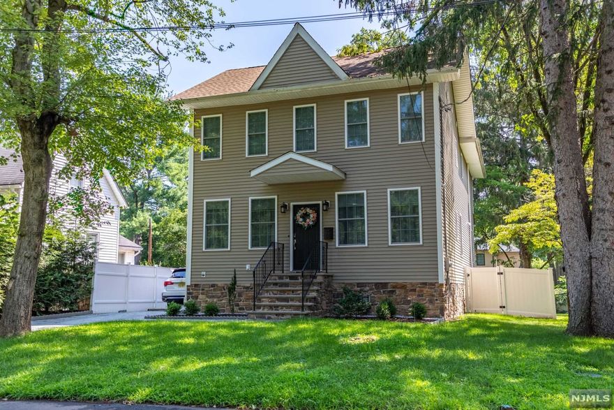 Quality construction in this renovated approximately 2700 square foot home. The first floor offers an entry foyer, powder room, open living room and dining room concept. The modern eat in kitchen opens to a family room with sliding glass doors to a rear private patio area. The 2nd floor features a master suite with his and her walk in closets and a modern spa bathroom. 3 additional good sized bedrooms and a full bath with whirlpool tub. Convenient second floor laundry. The full basement offers a large finished recreation area. Other amenities include 9 foot ceilings on the first level, gleaming hardwood floors throughout, recessed lighting, and plenty of parking. Close to schools, NYC transportation, and downtown shopping! Must see!