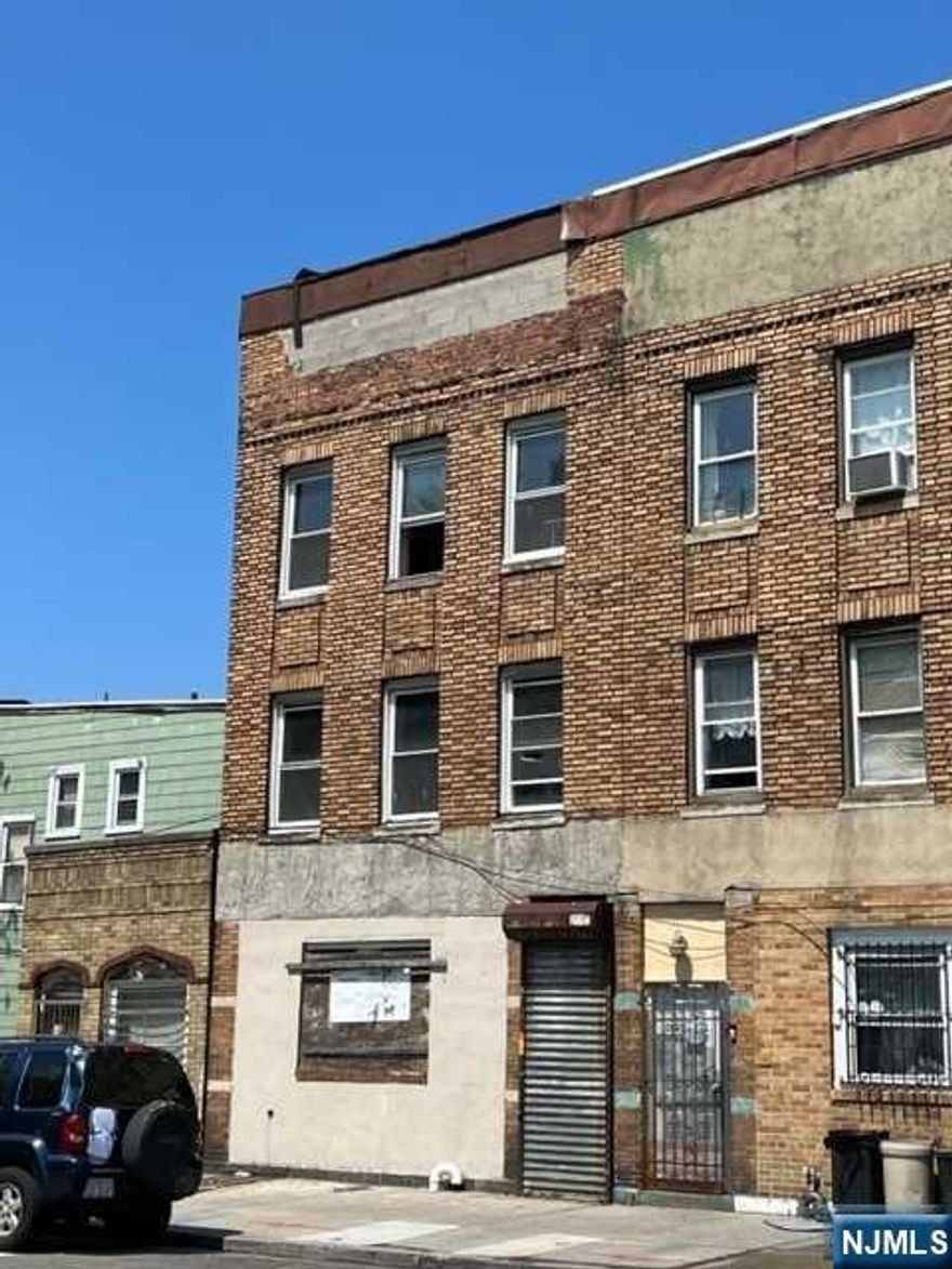3 units in need of total rehab including Framing, Electric, Plumbing, Heating, Sheet Rock, Flooring, and Roof. No off-street parking. Being Sold As-is. Make all offers based on the current condition of the property. Buyer to verify with City of Jersey City the legal usage of the property.
