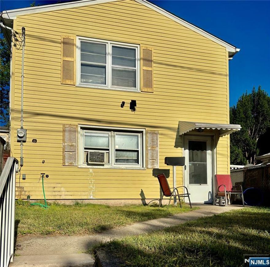 Now vacant and easy to show, 70 Orchard Street is a 3-bedroom, 2-bath home that finally makes owning more attractive than renting. With low taxes (approx. $4,934/year) and plenty of space inside and out, this is a chance to stop paying someone elseâ€™s mortgage and start building your own equity. Set on a deep lot with shady trees, a raised deck and storage shed â€“ a great foundation for a future garden, play area, or outdoor lounge. Inside, the layout is already functional: first floor features a large eat-in kitchen with ample cabinet and counter space, a comfortable living/dining area, full bathroom, and laundry/mudroom, washer & dryer included. Upstairs, three nicely sized bedrooms with good natural light and a second full bath. Yes, it needs renovation â€“ but thatâ€™s where the upside is. This is a true fixer-upper with good bones, offering the opportunity to choose your own finishes instead of paying a premium for someone elseâ€™s design. Located on a quiet one-way residential street in Garfield, youâ€™re close to schools, parks, local shops, restaurants, and major transportation routes, with convenient access to highways and transit options for commuters to Hudson County and New York City. On-street parking is readily available. Property is being sold strictly as-is and is priced to reflect the work needed. If youâ€™re ready to trade rent payments for a place of your own â€“ with a yard, space, and long-term potential â€“ 70 Orchard Street is an excellent opportunity