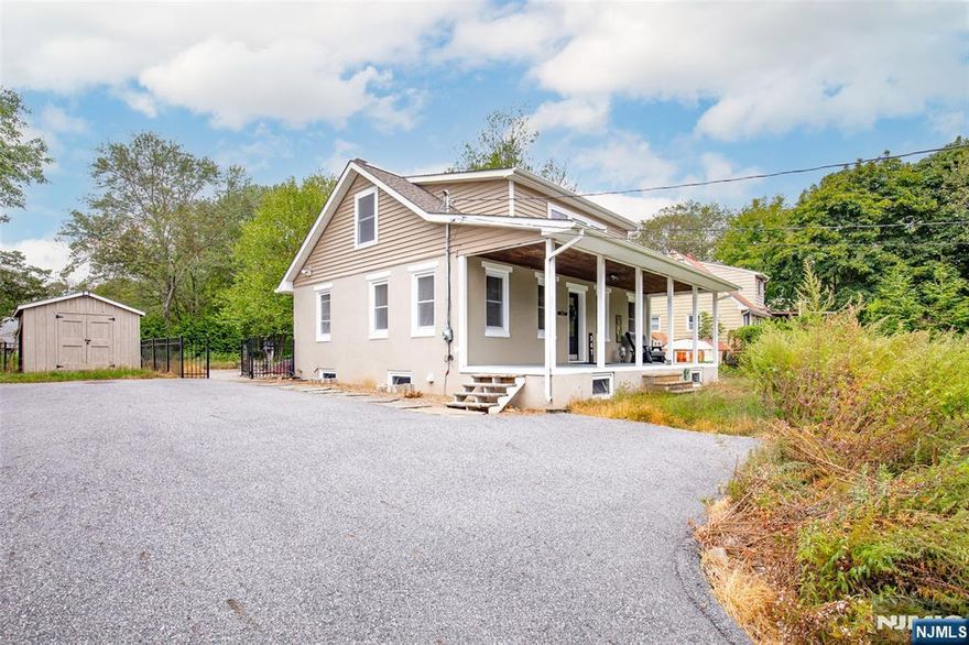 For more information on this home please contact Howard Wilson 201-739-2880 Lovely and move-in ready, this updated 1,331 sq ft 3-bedroom home blends charm and comfort. Enter from the welcoming lemonade porch to a sunlit living room with glistening hardwood floors. The gourmet kitchen features custom cabinets, granite counters, stainless appliances, and a farmhouse sink. Two well-sized bedrooms and a stylishly renovated full bath complete the first level. Upstairs, discover an oversized primary retreat with an extraordinarily large walk-in closet. The clean, dry basement offers laundry, utilities, and a bonus preserve cellar for garden canning. A fenced backyard with back-street access and a freestanding shed enhances easy living. True pride of ownership throughout.