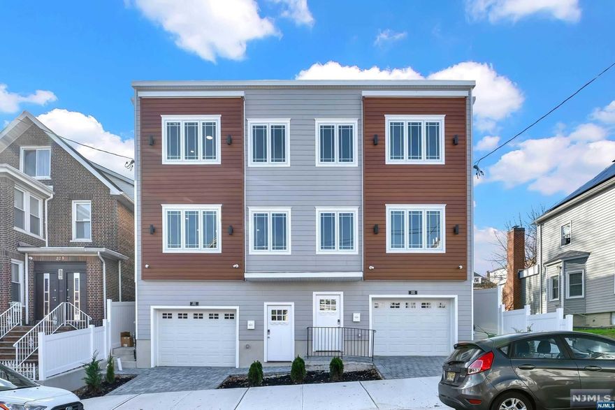 Discover convenience and luxury at 333 74th St, North Bergen. Commute to NYC in under 30 mins with direct buses on Bergenline Ave. Close to school, parks, and essentials. This new three-floor home by a local builder offers a spacious layout, quality craftsmanship, and high-end finishes. Work from your home office with exterior access through the tandem 2 car garage. Gather in the beautiful living room with a modern fireplace. The well-designed kitchen boasts stainless steel appliances, quartz countertops, and 2 butlers pantries. A spacious main floor primary en-suite with a balcony and backyard access, plus 3 bedrooms and a second primary en-suite on the top floor. The cozy backyard is perfect for summer barbecues. Your ideal city living awaits at 333 74th St. Welcome home!