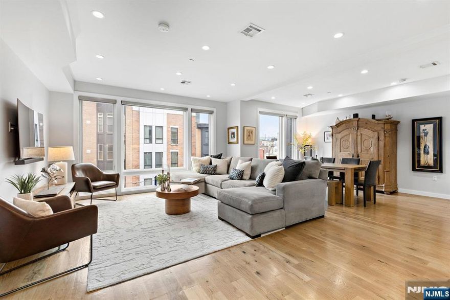 502 Monroe Street, 401 is a beautifully designed 4 bedroom, 3 bathroom duplex condominium with roof deck in a boutique elevator building with parking in midtown Hoboken. Built in 2017 this rarely available duplex condominium features an expansive open layout with a wall of large eastfacing windows that envelope the condominium with natural light. The custom gourmet kitchen includes an island with quartz waterfall countertops, professional series Thermador appliances, tiled backsplash, vented range hood, under cabinet lighting and plenty of storage. The main floor consists of living room, separate dining area, kitchen and two generously sized bedrooms, one with a walk-in closet and an adjacent bathroom that features Porcelanosa tile and frameless glass shower...