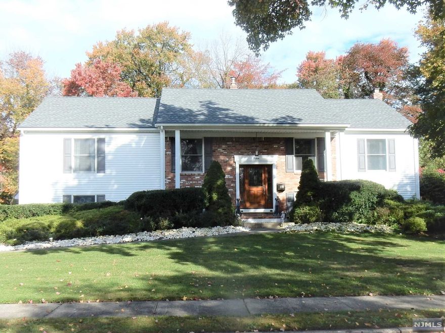 Absolutely Beautiful! This Updated 60' Bi-Level with 4 BR's; 2.5 Bths in One of Paramus' Premier Neighborhoods is in Pristine Move-in Condition. You'll Love this Striking Gourmet Kitchen with Granite Counters and glass-marble backsplash; Oversized Center Island; Sub-Zero Refrigerator; Wine Cooler, Bosch DW, Wolf Cooktop & Dbl Oven. Plan Fabulous Parties in this 25X14 Airy Three Season Room Overlooking a Serene Natural Setting, Vaulted Ceiling, & Skylights with access from the Kitchen and French Door in the Dining Room. Formal LR; Formal DR; Upgraded Hall Bth; First Floor Laundry; Vinyl Siding; CAC; Alarm with Central Station & Camera; I/G Sprinklers; Fully Fenced Yard; Oversized 2-Car Garage with Cedar Closet, Plus So Much More. Close to NY Trans, Parks, & Schools. Don't Miss This One!