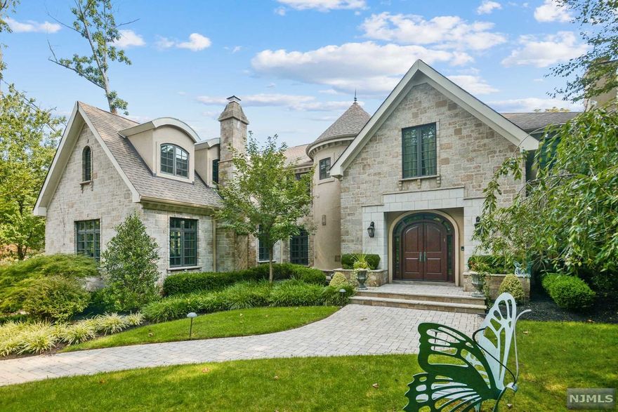 THE ULTIMATE IN SHORT HILLS LUXURY...welcome to 305 Glen Avenue. Enter into the gracious foyer of this magnificent dream home, where you'll be greeted by a beautiful winding staircase. A formal living room opens right into an office complete with custom millwork, perfect for working from home. The sun-drenched family room with french doors overlooks the backyard oasis and flows into the gourmet kitchen redone in 2018. A butler's pantry off the kitchen leads you past one of two powder rooms on the first floor, right into the cozy den complete with a fireplace and bar. The large dining room is ideal for a variety of gatherings. Upstairs, the primary bedroom is sure to impress, featuring a sitting room, luxurious bathroom with separate shower/soaking tub, and walk-in closets. Four en-suite bedrooms round out the second floor. Fully finished basement with bedroom ensuite, rec room and gym. Resort-style yard with pool, pool house, outdoor kitchen and yard. It doesn't get any better.