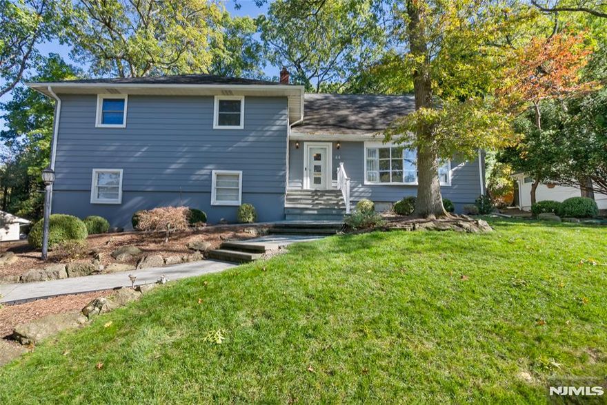 A rare opportunity in Livingston. Nestled in one of Livingston's most sought-after neighborhoods, this thoughtfully designed 5-bedrooms & 2.5-bath home offers generous space and flexible living options. The inviting floor plan combines comfort and functionality, creating a warm and welcoming atmosphere throughout. Bright living and dining areas flow seamlessly into the kitchen and main living spaces, creating a functional and inviting setting for both everyday living and entertaining alike. A light-filled family room/den overlooks the backyard & opens directly to the patio, providing abundant natural light and a seamless indoor-outdoor connection with direct access to the yard. The second level offers three generously sized bedrooms and two full baths. The third floor includes two additional spacious bedrooms ideal for guests, home office, or flexible use. There is also an extra-large storage room with additional closet space. A finished basement offering versatile recreation, gym or play area. Beautifully landscaped, recently renovated backyard. Lovely patio and deck providing a private setting for relaxation and entertaining, with plenty of room to enjoy the outdoors. Ideally located within walking distance to top rated schools, houses of worship, and public transportation. A standout Livingston home that truly feels like a gem.