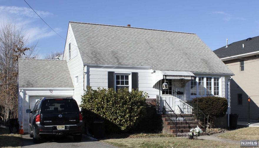 Don't Miss This 3 Bedroom 2 Full Bath Cape Cod on a 200' Deep Lot Located on Residential Street in Elmwood Park. First Floor Offers a Living Room, Two Bedrooms, Full Bath, Kitchen w/ Granite Countertops & SS Appliances, Dining Area With Sliding Glass Doors Leading to Deck & Large Yard. Second Floor Offers a Large Bedroom w/ Full Bath. Full Unfinished Basement, Attached 1 Car Garage, & Hardwood Floors.