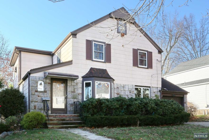 Attention contractors or buyers looking for a house to update in the wonderful town of River Edge. This home is a solid, side hall colonial with great curb appeal, located on one of the town's prettiest streets. Per tax records 2015 sq feet on a 60 x 125 lot. The masonry work and stone front is in excellent shape. First floor offers a foyer with closet, office area, spacious LR w/ bay window Dining Rm, Sunny Eat in Kitchen, Family Room addition and half bath & mudroom area. All three (3) BRs are large, Master with room for a king-sized bed. Andersen replacement windows throughout. Roof replaced in 2011, Furnace replaced in 2007. Basement has good ceiling height. Deep yard. Great potential to expand with strong surrounding values. Sold strictly "as is".