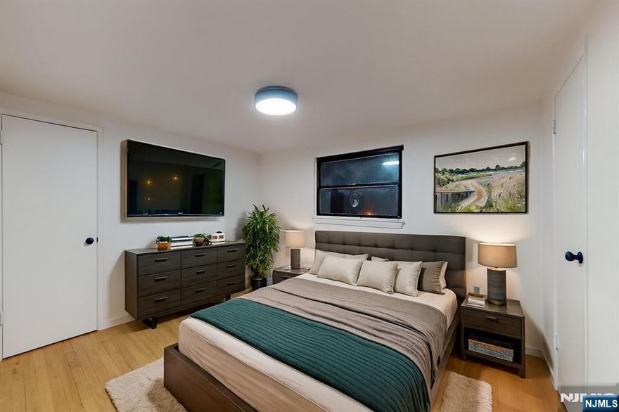 Live bigger in Elmwood Park! This bright 3BR/1BA blends charm and updates: sun-splashed living room, dining nook, sleek kitchen with stainless appliances and great storage, hardwood floors, recessed lighting, and ceiling fans. King-size bedrooms, refreshed bath. Quiet tree-lined block close to NJ Transit, parks, shops, and dining. Move-in ready with an easy commute. Space, style, and convenience start your next chapter at 204 Philip Ave.