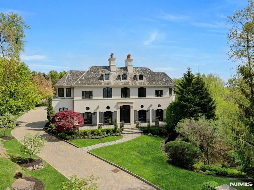 NEW YORK CITY VIEWS! WESTERN SUNSET VIEWS! PERCHED MAJESTICALLY AT THE HIGHEST POINT IN ALL OF ALPINE! PANORAMIC VIEWS WRAPPING THE CUL-DE-SAC OF AUTUMN TERRACE. THIS HOUSE BOASTS APPROX. 12,000 SQ.FT. OF LUXURIOUS LIVING SPACE FEATURING 5 PUBLIC RECEPTION ROOMS, A LARGE CHEFS KITCHEN AND A ROTUNDA RECEPTION FOYER. THE 2ND FLOOR HAS 2 PRIMARY BEDROOM SUITES EACH W/A SITTING ROOM, AND ONE WITH A YOGA STUDIO, ALONG W/ 4 FAMILY BEDROOMS AND BATHS. 2 SEPARATE STAFF BEDROOMS. THE THEATER, GYM, SECOND KITCHEN AND ENTERTAINMENT ROOM ARE ALL FEATURED ON THE LOWER LEVEL W/ HIGH CEILINGS. MAGNIFICENT POOL, GREEN HOUSE, AND VEGETABLE GARDEN ALL COMPLIMENT THE SOUTH GROUNDS. ACROSS THE CUL-DE-SAC, AN ADDITIONAL NEW CONSTRUCTION 5,000 GUEST HOUSE IS AVAILABLE ON A 2 ACRE LOT. (#18 AUTUMN TERRACE, OFFERED AT $6,900,000.) W/A SENSATIONAL 1,500 SQUARE FOOT TWO-STORY GREAT ROOM, WET BAR, CHEFS KITCHEN, OFFICE, MEDIA ROOM, ALL W/EGRESS TO BEAUTIFUL STONE PATIOS AND AN OUTDOOR FIRE PIT WHILE ENJOYING SWEEPING SUNSET VISTAS TOWERING OVER THE NORTHERN VALLEY. THE GUEST HOUSE ALSO HAS AN ADDITIONAL 2 BEDROOMS W/3 FULL AND 2 HALF BATHS. BOTH HOUSES HAVE GENERATORS. 8 MILES FROM NEW YORK CITY!!